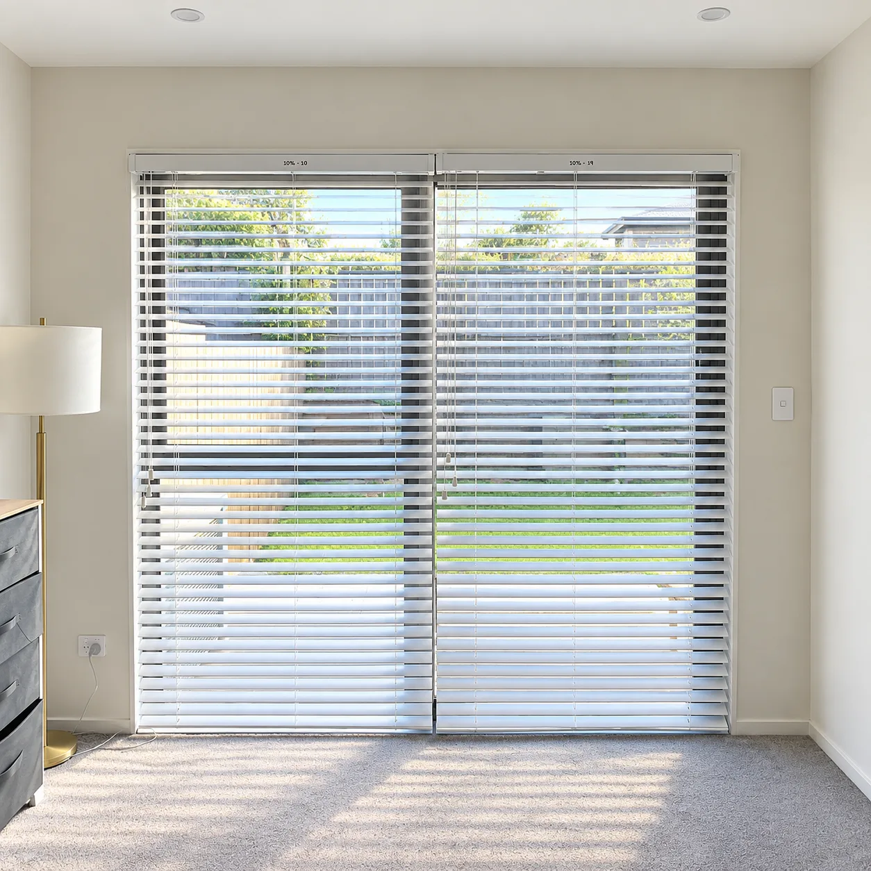 Sliding door with white venetian blinds fitted